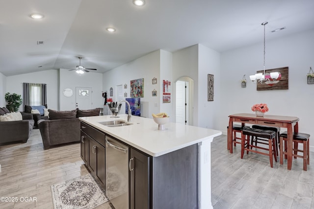 2008 Greydon Ln, Webb City, MO 64870 - kitchen featuring stainless steel dishwasher, arched walkways, ceiling fan, light wood-style floors, and vaulted ceiling
