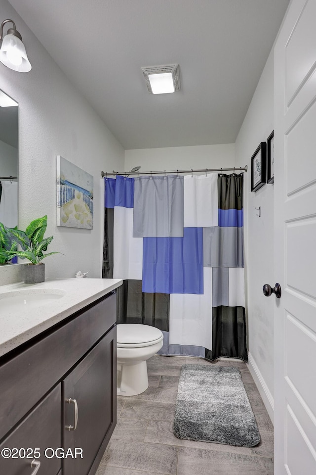 2008 Greydon Ln, Webb City, MO 64870 - bathroom with vanity, wood finished floors, and curtained shower