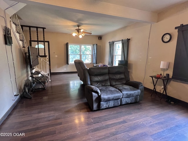 303 E Centennial Ave, Carthage, MO 64836 - living room with wood finished floors, a barn door, ceiling fan, and stairs