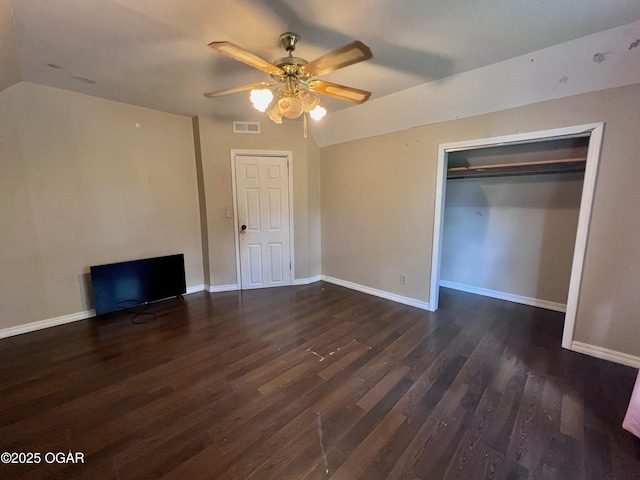 303 E Centennial Ave, Carthage, MO 64836 - unfurnished bedroom with wood finished floors, lofted ceiling, a closet, and a ceiling fan