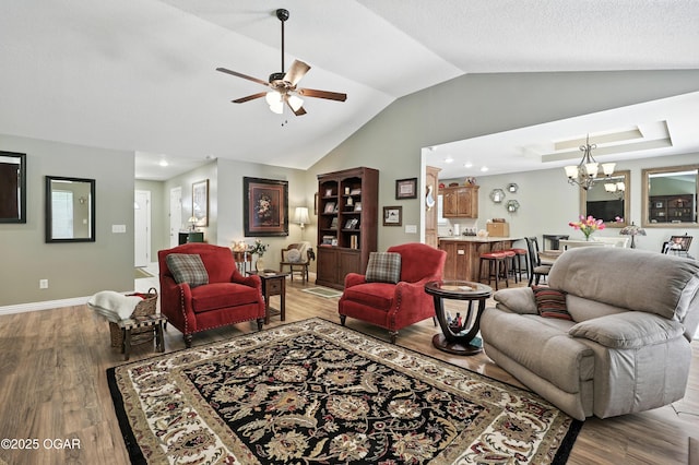 302 E 44th St, Joplin, MO 64804 - living room with vaulted ceiling, light wood-type flooring, a chandelier, ceiling fan, and recessed lighting