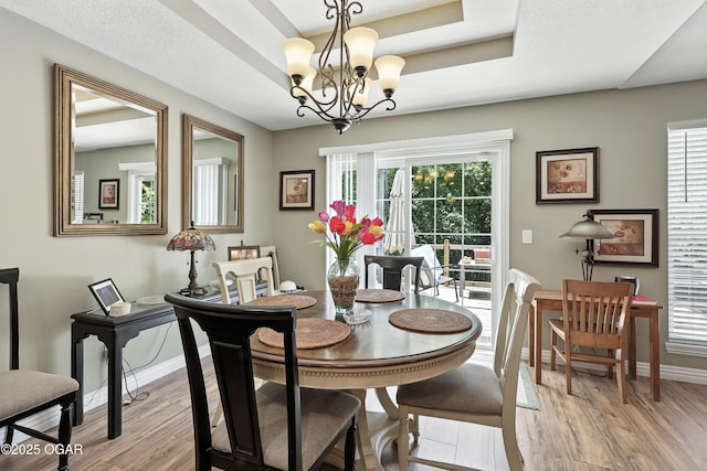 302 E 44th St, Joplin, MO 64804 - dining area with light wood finished floors and a chandelier