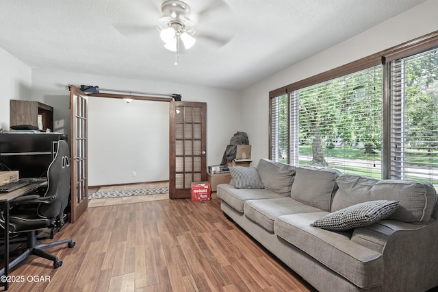 1901 Laura Ln, Joplin, MO 64801 - office with wood finished floors, a ceiling fan, and french doors