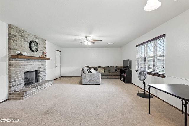 1901 Laura Ln, Joplin, MO 64801 - carpeted living room featuring a ceiling fan and a brick fireplace