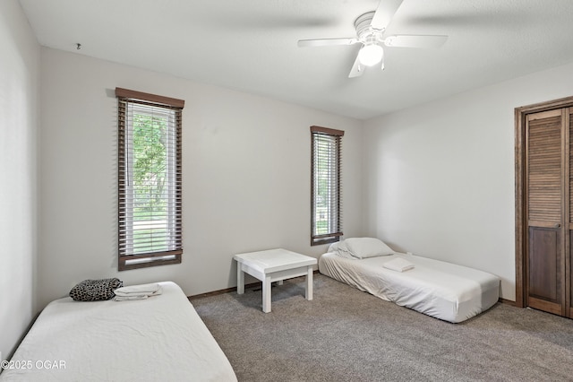 1901 Laura Ln, Joplin, MO 64801 - bedroom featuring light carpet, a ceiling fan, and a closet
