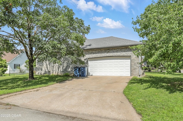 1901 Laura Ln, Joplin, MO 64801 - view of front of home with a front yard, concrete driveway, brick siding, and an attached garage