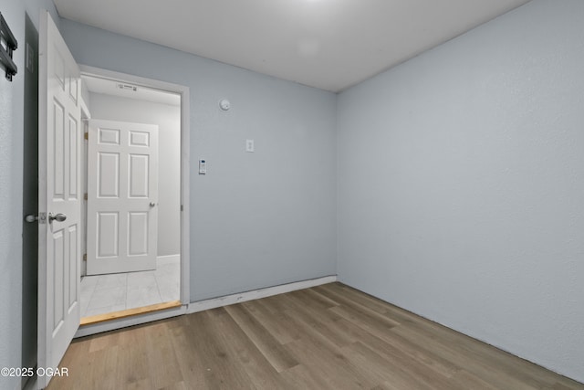 119 Jared Blvd, Webb City, MO 64870 - empty room featuring wood finished floors and baseboards