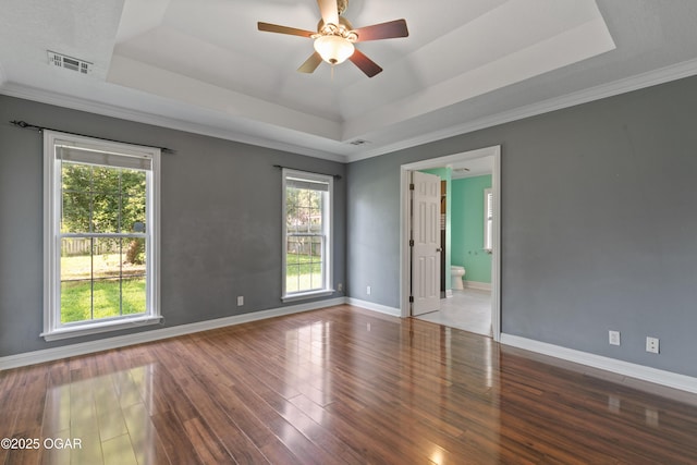 119 Jared Blvd, Webb City, MO 64870 - spare room featuring a raised ceiling, wood finished floors, and ceiling fan