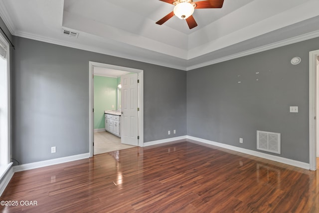 119 Jared Blvd, Webb City, MO 64870 - unfurnished room featuring a ceiling fan, a raised ceiling, wood finished floors, ornamental molding, and a smoke detector