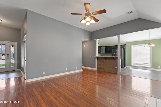 119 Jared Blvd, Webb City, MO 64870 - unfurnished living room with plenty of natural light, wood finished floors, a ceiling fan, ornate columns, and lofted ceiling