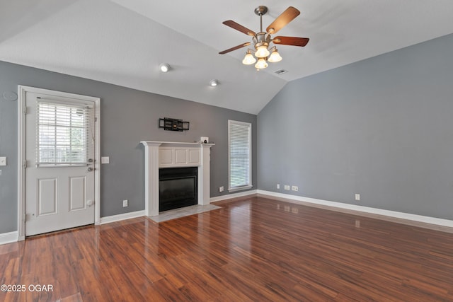 119 Jared Blvd, Webb City, MO 64870 - unfurnished living room with vaulted ceiling, ceiling fan, wood finished floors, and a fireplace with flush hearth