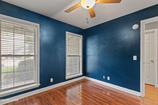 119 Jared Blvd, Webb City, MO 64870 - spare room with wood finished floors, a smoke detector, and a ceiling fan