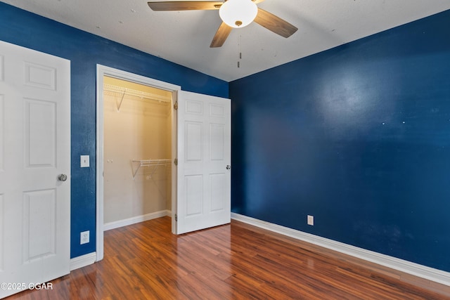 119 Jared Blvd, Webb City, MO 64870 - unfurnished bedroom with wood finished floors, a closet, and a ceiling fan