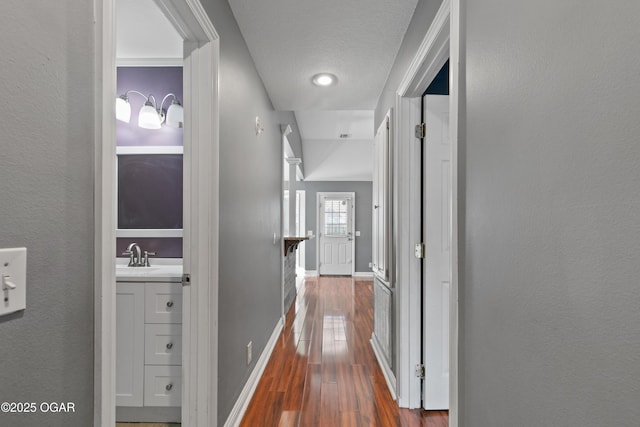 119 Jared Blvd, Webb City, MO 64870 - hallway with dark wood-type flooring and baseboards