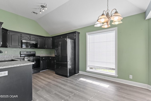 119 Jared Blvd, Webb City, MO 64870 - kitchen with refrigerator with ice dispenser, stainless steel microwave, electric range, a chandelier, and vaulted ceiling