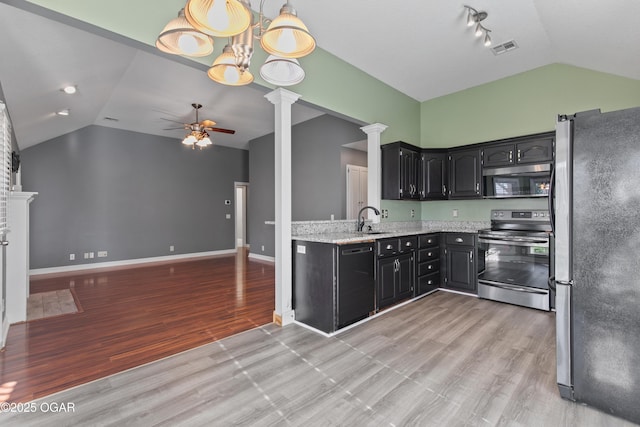119 Jared Blvd, Webb City, MO 64870 - kitchen featuring stainless steel appliances, vaulted ceiling, ornate columns, ceiling fan, and light wood finished floors
