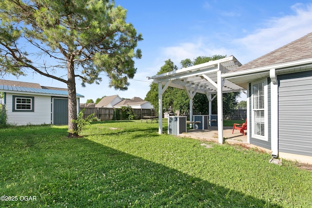 119 Jared Blvd, Webb City, MO 64870 - fenced backyard with a pergola, a patio, and an outdoor structure