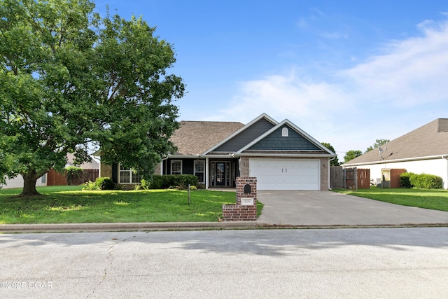 119 Jared Blvd, Webb City, MO 64870 - view of front of house featuring an attached garage, concrete driveway, and brick siding