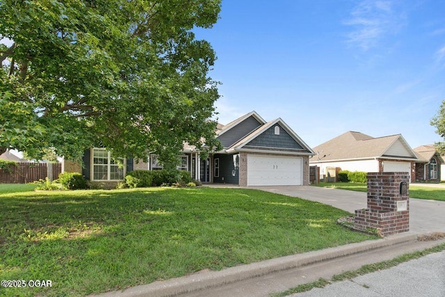 119 Jared Blvd, Webb City, MO 64870 - view of front of home featuring an attached garage, concrete driveway, and brick siding