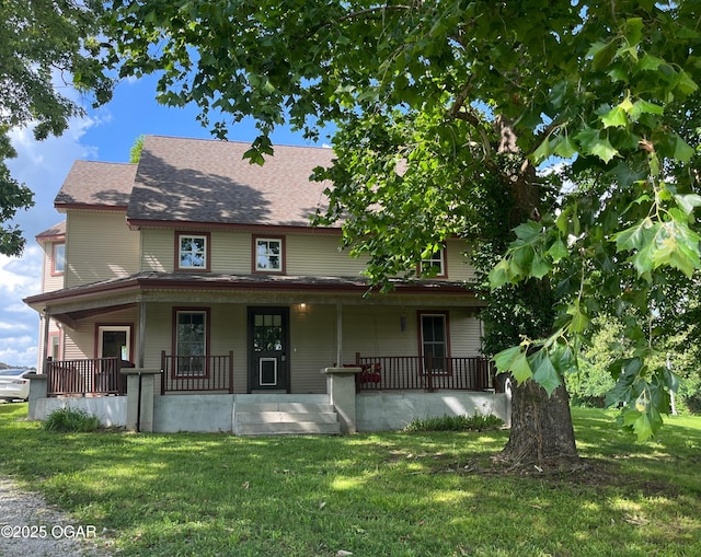 1631 County Road 120, Carthage, MO 64836 - view of front facade featuring a front lawn, a porch, and roof with shingles