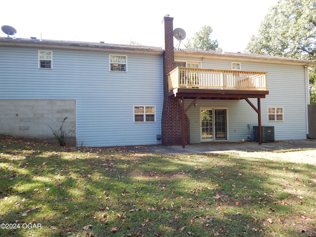 3065 Coyote Dr, Joplin, MO 64804 - back of house featuring a yard, a wooden deck, and a chimney