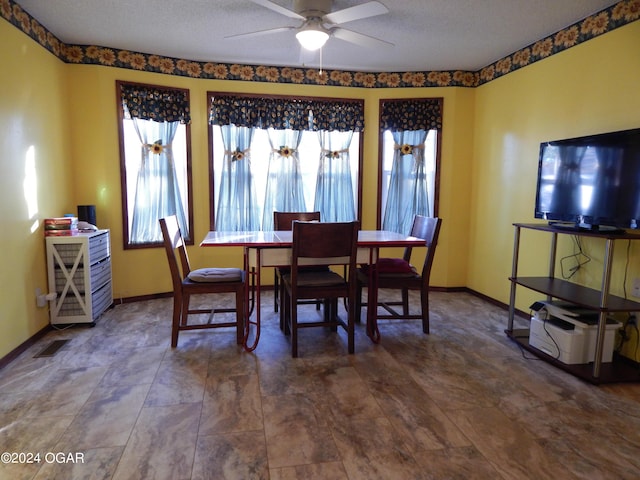 3065 Coyote Dr, Joplin, MO 64804 - dining area with a ceiling fan and a textured ceiling