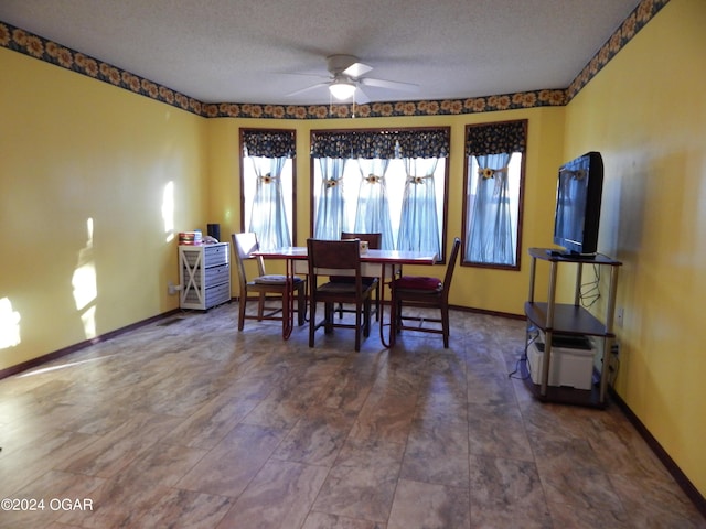 3065 Coyote Dr, Joplin, MO 64804 - dining room with ceiling fan and a textured ceiling