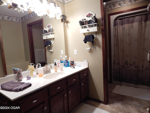 3065 Coyote Dr, Joplin, MO 64804 - bathroom with vanity, a chandelier, and curtained shower