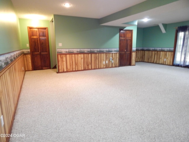 3065 Coyote Dr, Joplin, MO 64804 - carpeted empty room with wainscoting, wood walls, and recessed lighting