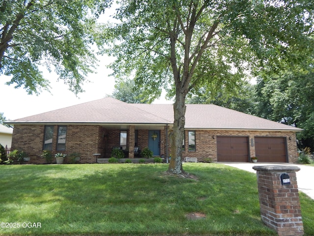 2722 E Wickersham Rd, Joplin, MO 64804 - ranch-style house featuring brick siding, a garage, a front yard, driveway, and a shingled roof