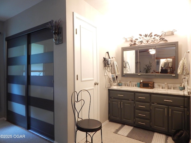 2722 E Wickersham Rd, Joplin, MO 64804 - bathroom featuring double vanity and baseboards