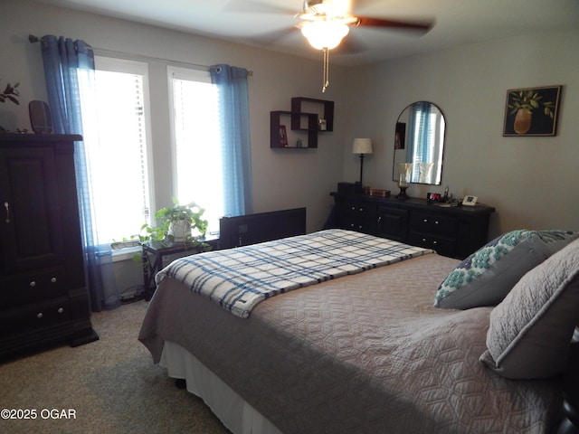 2722 E Wickersham Rd, Joplin, MO 64804 - bedroom featuring multiple windows, light carpet, and a ceiling fan