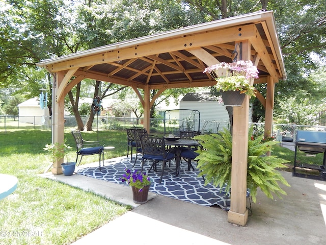 2722 E Wickersham Rd, Joplin, MO 64804 - fenced backyard with a gazebo, a patio, outdoor dining area, a grill, and a storage unit
