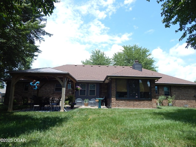 2722 E Wickersham Rd, Joplin, MO 64804 - back of property featuring a patio, a yard, brick siding, and a gazebo