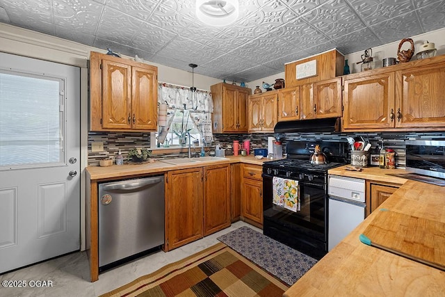 417 S Mcgregor St, Carthage, MO 64836 - kitchen featuring stainless steel dishwasher, black gas range, butcher block countertops, an ornate ceiling, and tasteful backsplash