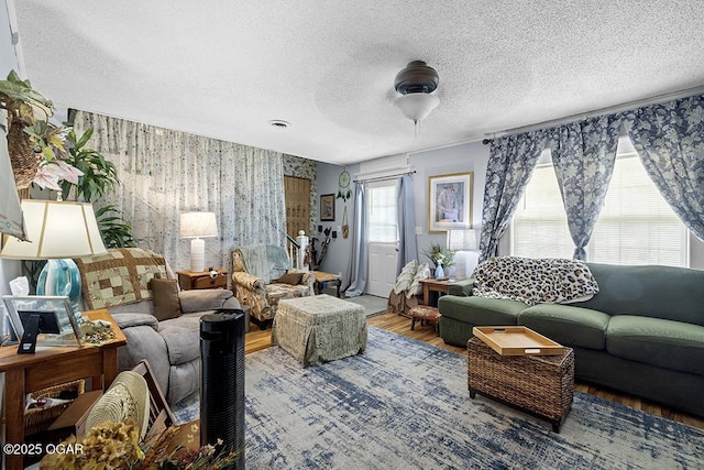 417 S Mcgregor St, Carthage, MO 64836 - living area with wallpapered walls, wood finished floors, and a textured ceiling