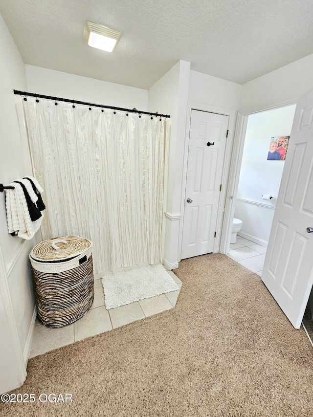 2813 Heartland Ave, Joplin, MO 64804 - bathroom featuring curtained shower, tile patterned floors, and carpet floors