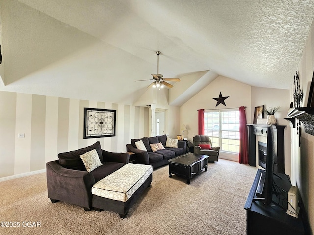 2813 Heartland Ave, Joplin, MO 64804 - living area with carpet, a glass covered fireplace, a ceiling fan, and vaulted ceiling