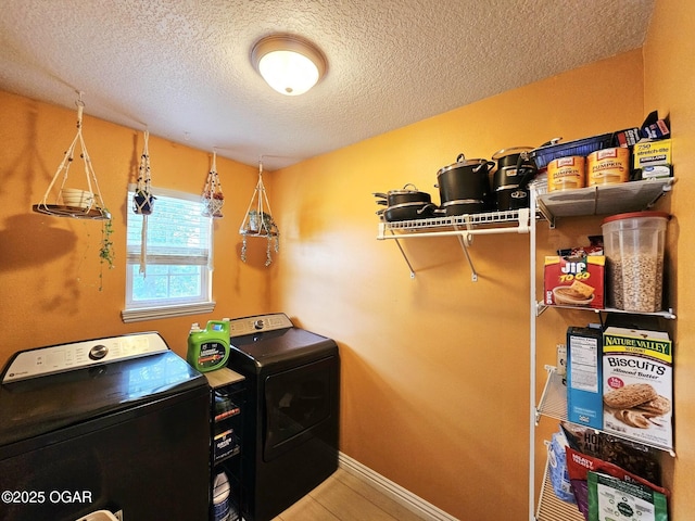 2813 Heartland Ave, Joplin, MO 64804 - laundry room featuring washing machine and clothes dryer and a textured ceiling