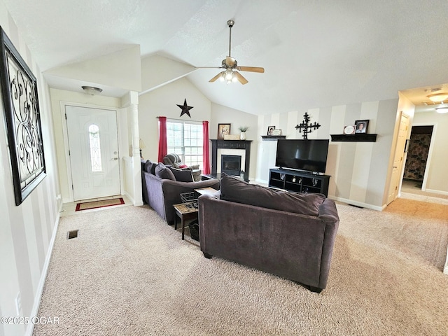 2813 Heartland Ave, Joplin, MO 64804 - living area with ceiling fan, carpet, lofted ceiling, and a glass covered fireplace