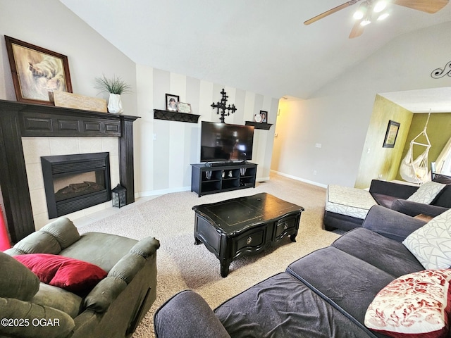 2813 Heartland Ave, Joplin, MO 64804 - carpeted living area with lofted ceiling, a ceiling fan, and a tiled fireplace