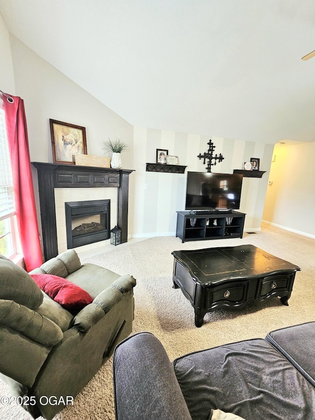 2813 Heartland Ave, Joplin, MO 64804 - carpeted living room featuring vaulted ceiling and a tile fireplace
