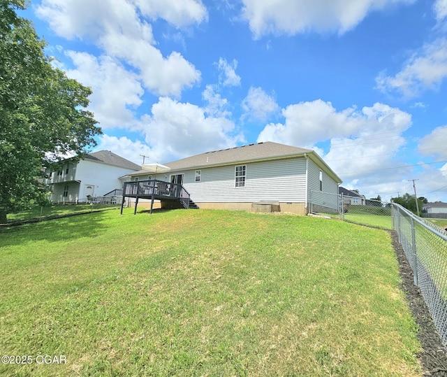 2813 Heartland Ave, Joplin, MO 64804 - rear view of property with a deck, a fenced backyard, crawl space, and stairs