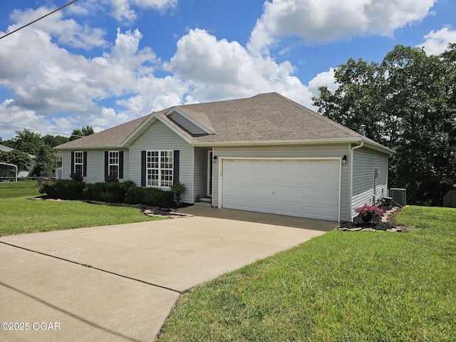 2813 Heartland Ave, Joplin, MO 64804 - ranch-style house featuring a front lawn, concrete driveway, an attached garage, and roof with shingles