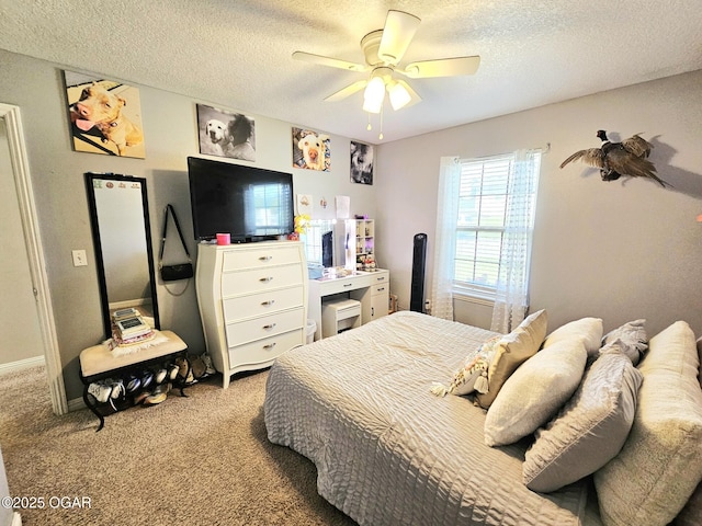 2813 Heartland Ave, Joplin, MO 64804 - bedroom featuring a textured ceiling, carpet, and a ceiling fan
