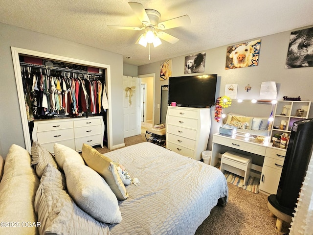 2813 Heartland Ave, Joplin, MO 64804 - carpeted bedroom with a closet, a textured ceiling, and ceiling fan