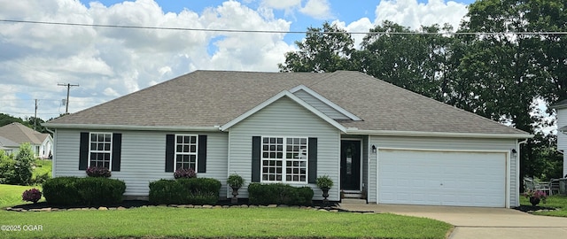 2813 Heartland Ave, Joplin, MO 64804 - view of front of property with a garage, roof with shingles, concrete driveway, and a front lawn