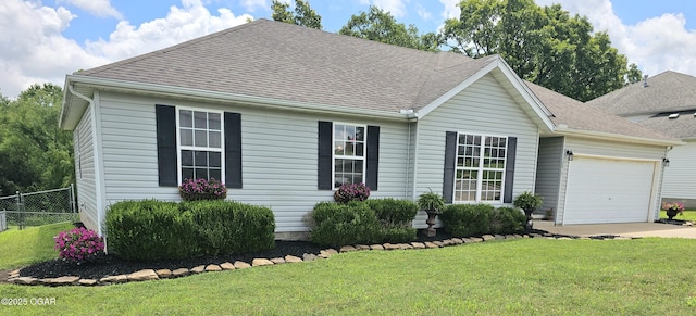 2813 Heartland Ave, Joplin, MO 64804 - view of front of home featuring a garage, driveway, and roof with shingles