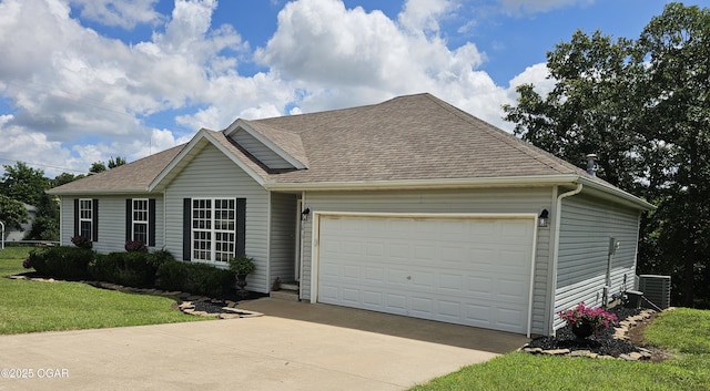 2813 Heartland Ave, Joplin, MO 64804 - view of front of property featuring an attached garage, a front yard, roof with shingles, and concrete driveway