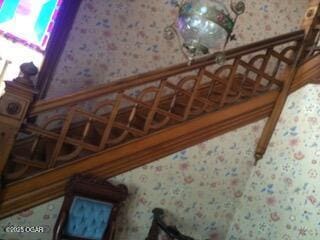 729 W Central Ave, Carthage, MO 64836 - staircase featuring wallpapered walls